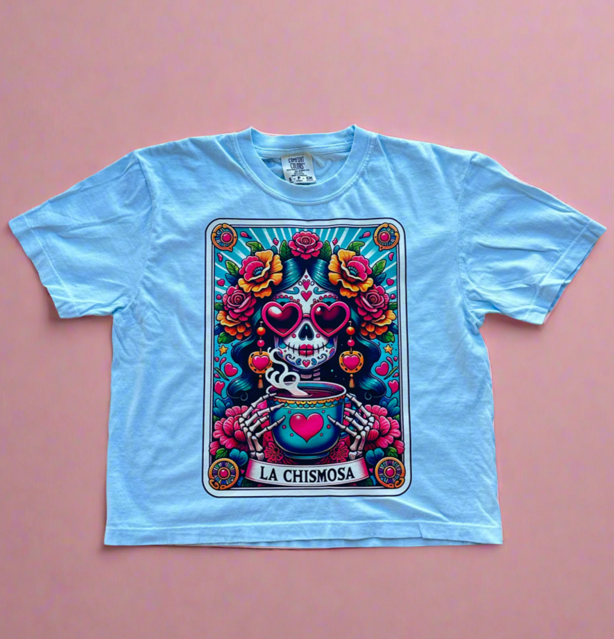 light blue crop top with a colorful la chismosa tarot in the front
