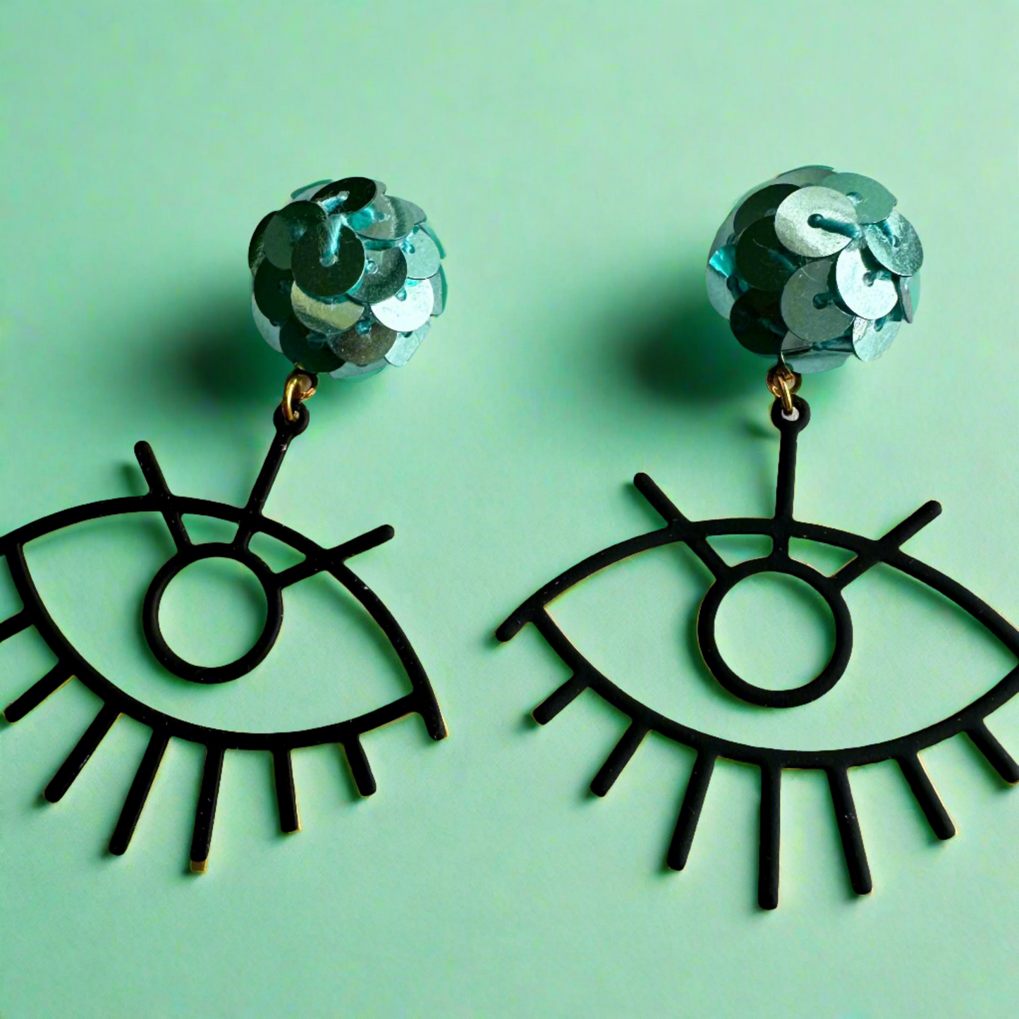 blue sequin and black ojito earrings
