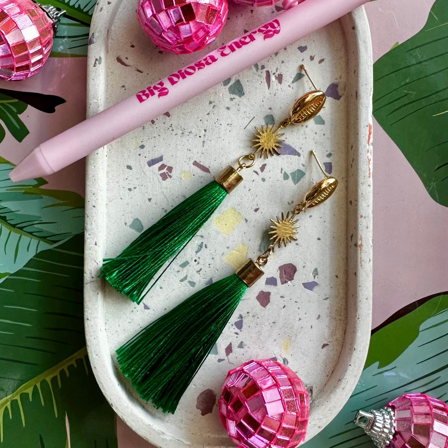 stylish statement earring with green tassel and gold accents