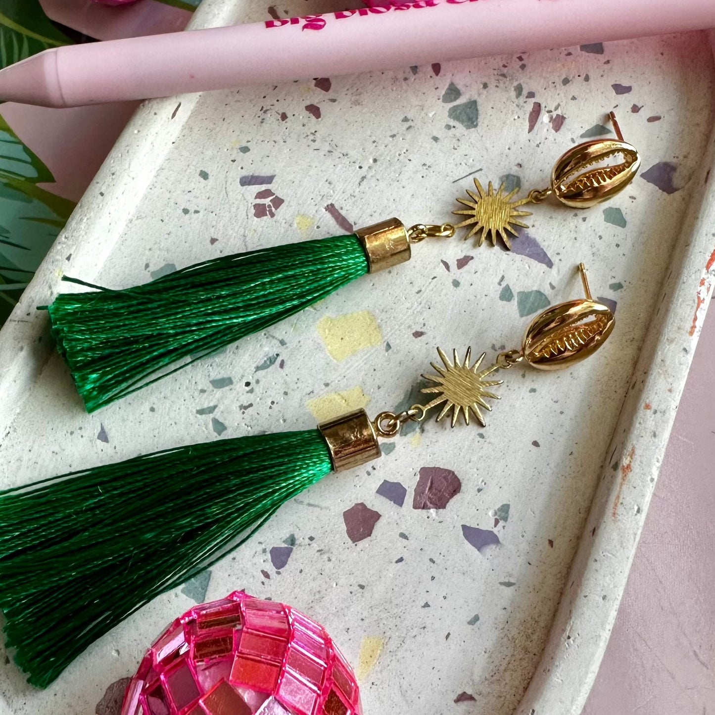 stylish statement earring with green tassel and gold accents