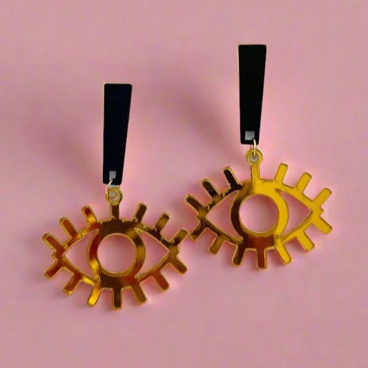 gold eyes on a black dangle earrings