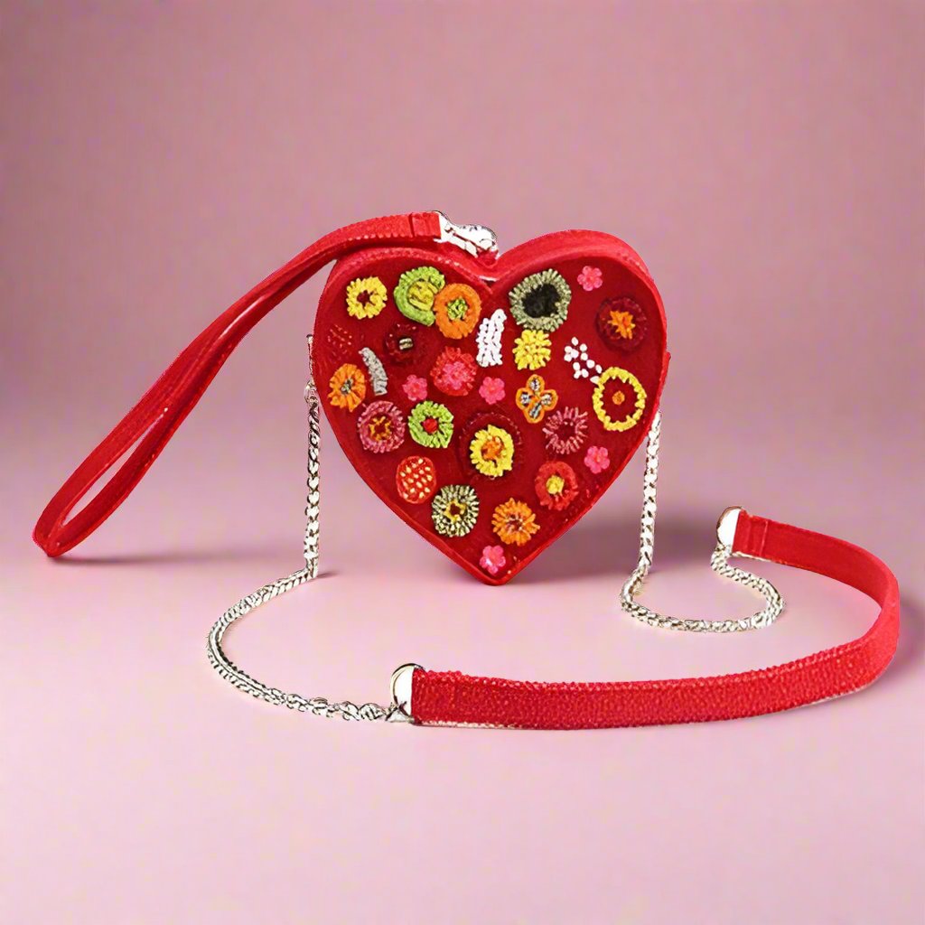 red beaded fair trade clutch with strap and hand loop