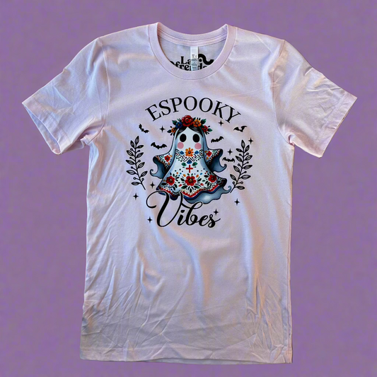 espooky vibe ghost print on a light pink t shirt