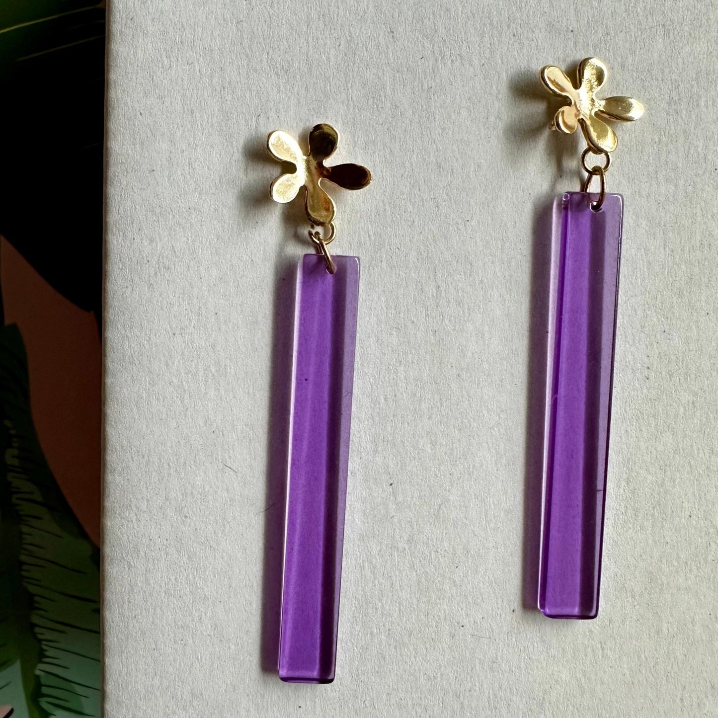 old flower post with a beautifully colored purple dangle