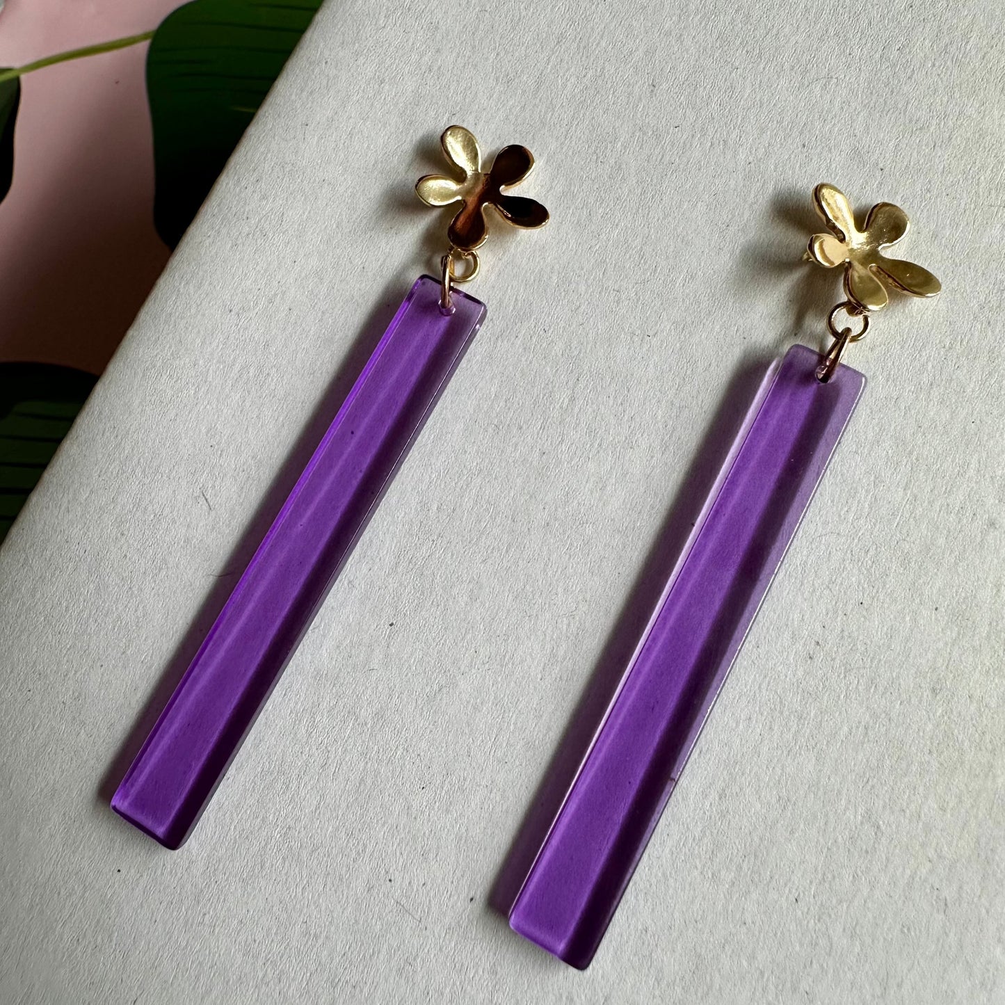 old flower post with a beautifully colored purple dangle