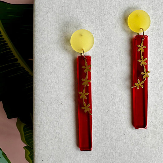 red dangle with gold flower trail and yellow posts