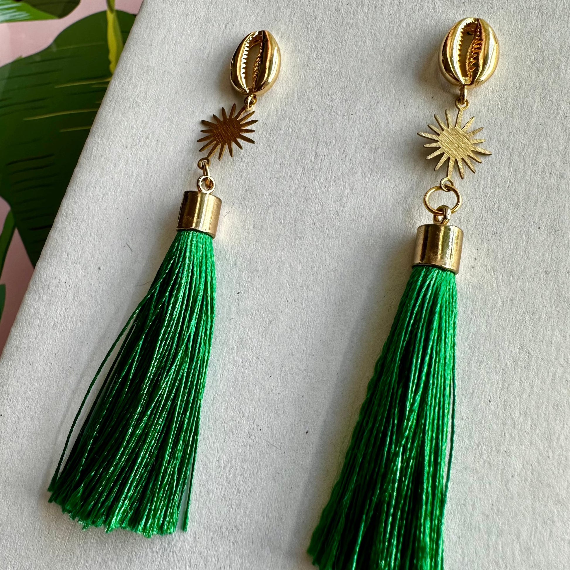  stylish statement earring with green tassel and gold accents 