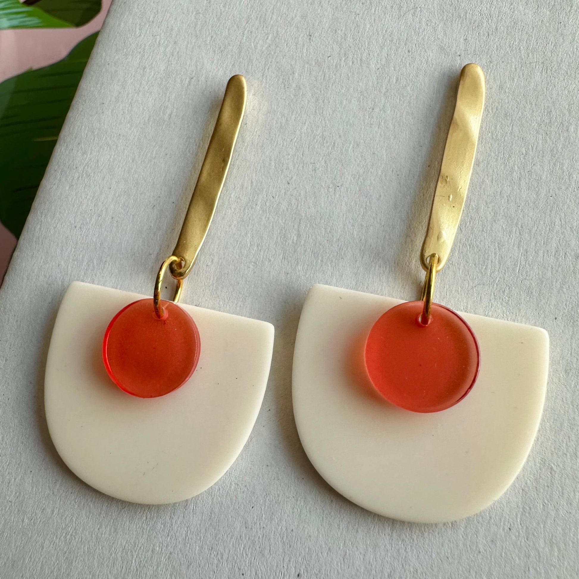 pink and gold earrings that are playful and chic