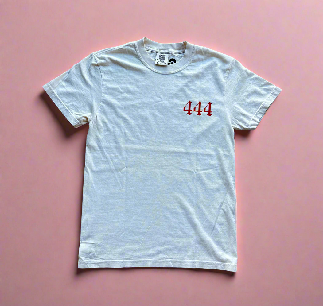 44r print on the front pocket of an ivory shirt